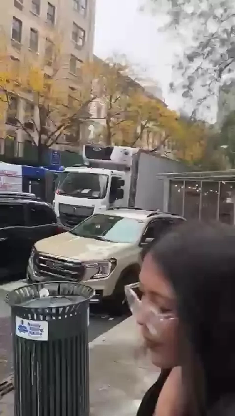 Frances Hamed Rips Down Posters of Kidnapped Israeli Civilians_#15